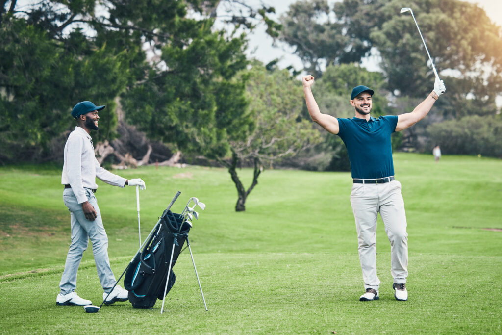 Golf course, men friends and celebration for winning, eagle shot or training together with happiness. Black man, golfer and field for sports, celebrate or winner at summer competition with diversity